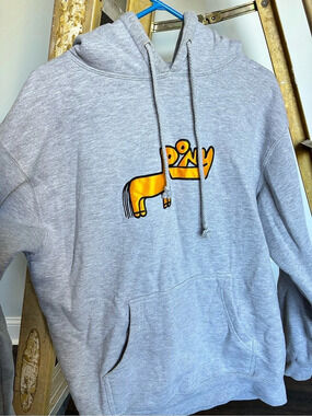 Rex Orange County hoodie with orange cartoon